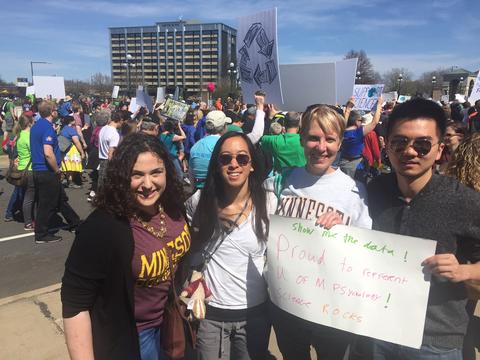 Addie, Viann, Pat, Xiang holding sign at March for Science Minneapolis